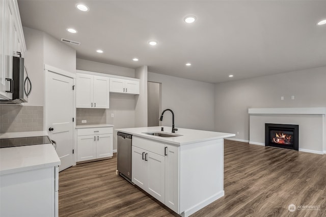 kitchen featuring sink, white cabinets, dark wood-type flooring, and appliances with stainless steel finishes