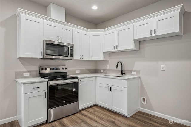 kitchen with white cabinetry, sink, and appliances with stainless steel finishes