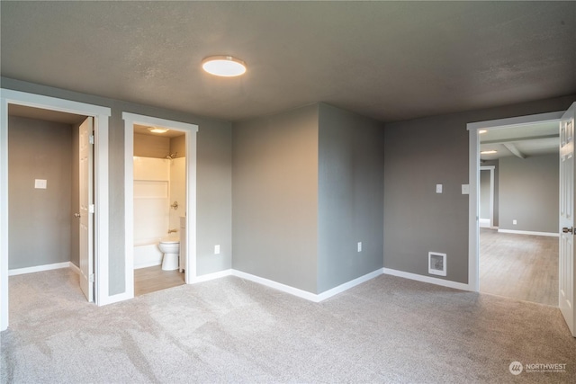 unfurnished room with light colored carpet