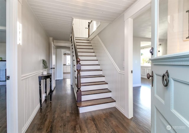 staircase with hardwood / wood-style floors