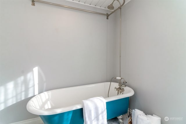 bathroom featuring a tub to relax in