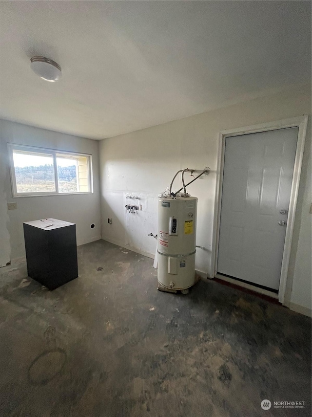 interior space with hookup for an electric dryer and strapped water heater