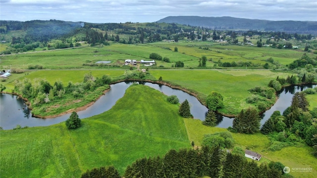 bird's eye view featuring a rural view and a water and mountain view