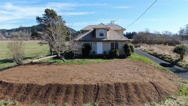 view of front of property featuring metal roof