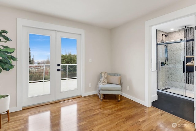 doorway featuring french doors and light hardwood / wood-style flooring