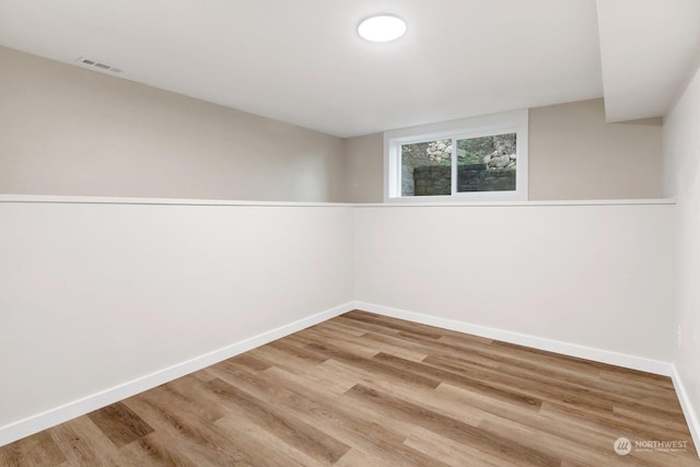 spare room featuring hardwood / wood-style flooring