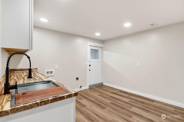 office area featuring hardwood / wood-style floors and sink