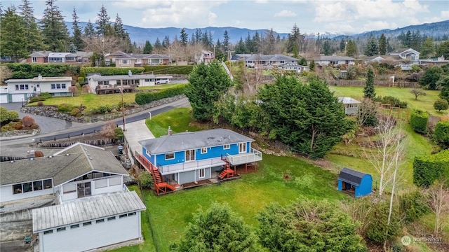 birds eye view of property with a mountain view