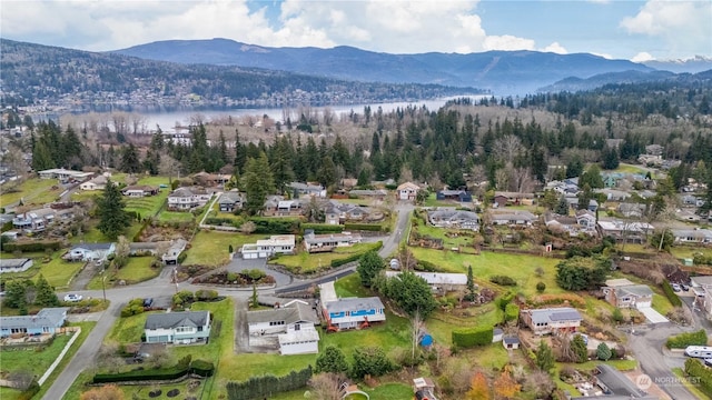 bird's eye view with a water and mountain view