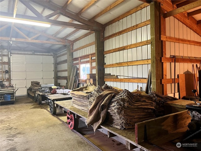 garage featuring wood walls