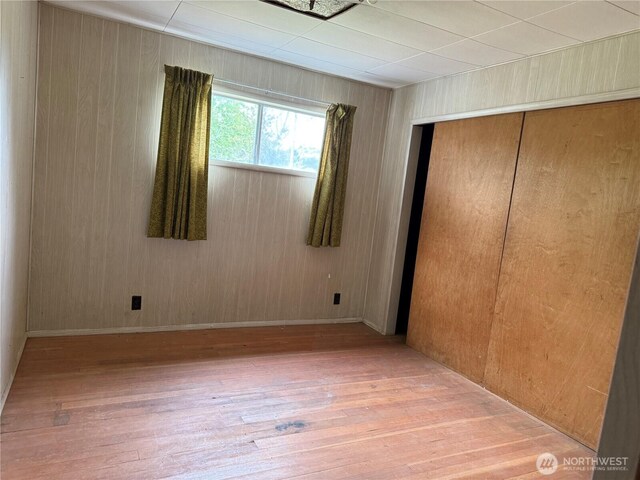 2978 Alexson Rd, North Cove, WA 98547 - unfurnished bedroom featuring wood finished floors, a closet, and wood walls