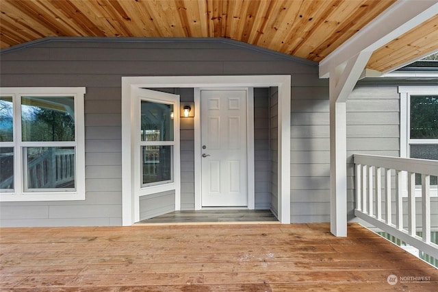 entrance to property with a wooden deck