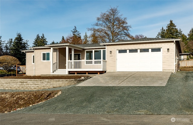 view of front of home with a garage and covered porch