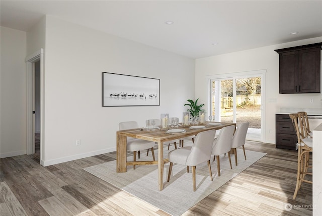 dining space featuring light wood-type flooring