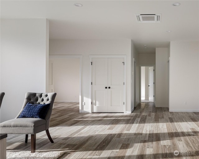 living area featuring hardwood / wood-style flooring