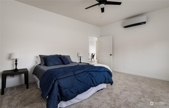 bedroom with ceiling fan, a wall mounted AC, and carpet floors