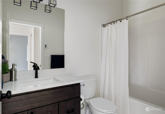 full bathroom featuring shower / bathtub combination with curtain, vanity, and toilet