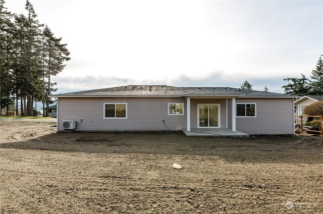 rear view of property featuring ac unit and a patio