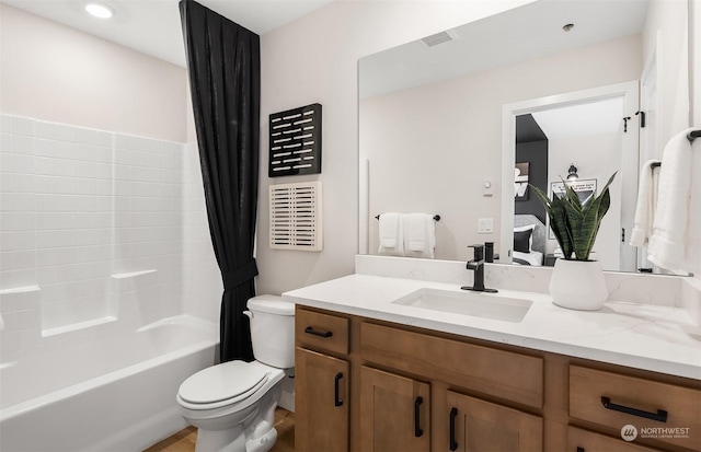 full bathroom with vanity, toilet, and shower / tub combo