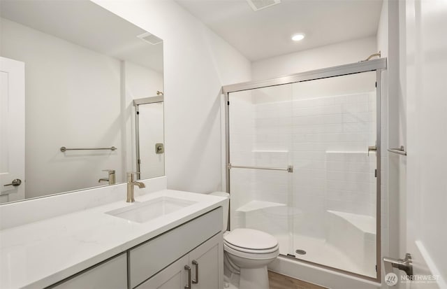 9014 NE 203rd Ln Unit B, Bothell, WA 98011 - bathroom featuring a stall shower, toilet, vanity, and wood finished floors