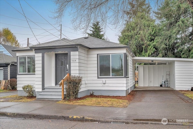 view of front of home featuring a carport