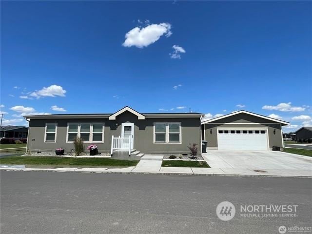 ranch-style home with a garage