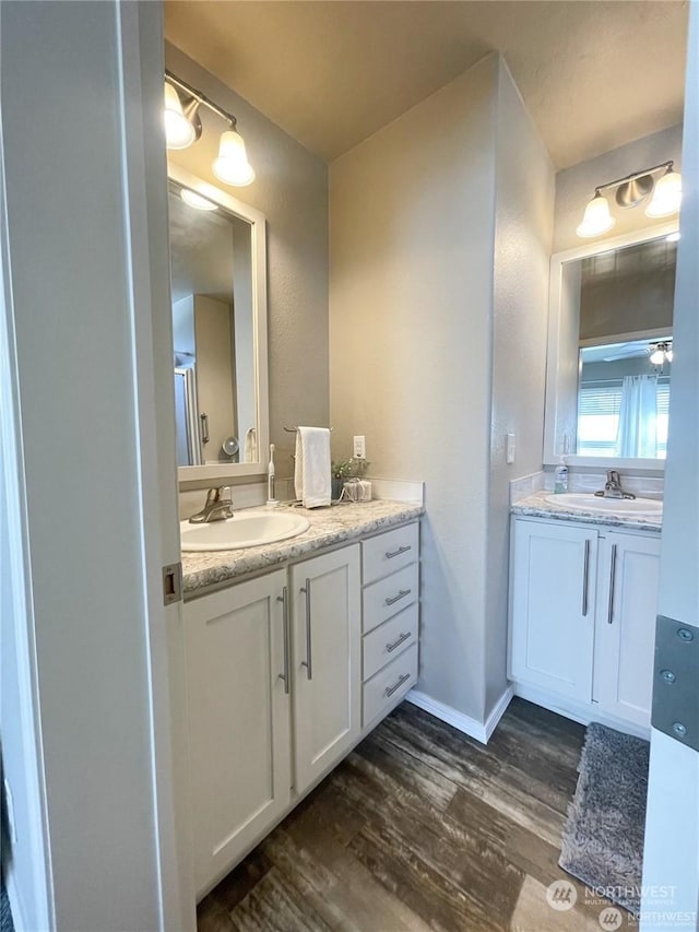 bathroom featuring vanity and hardwood / wood-style flooring