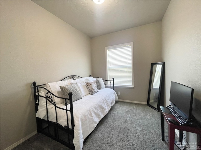 carpeted bedroom with vaulted ceiling