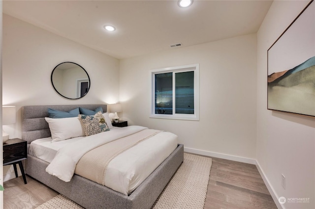 bedroom with light hardwood / wood-style floors