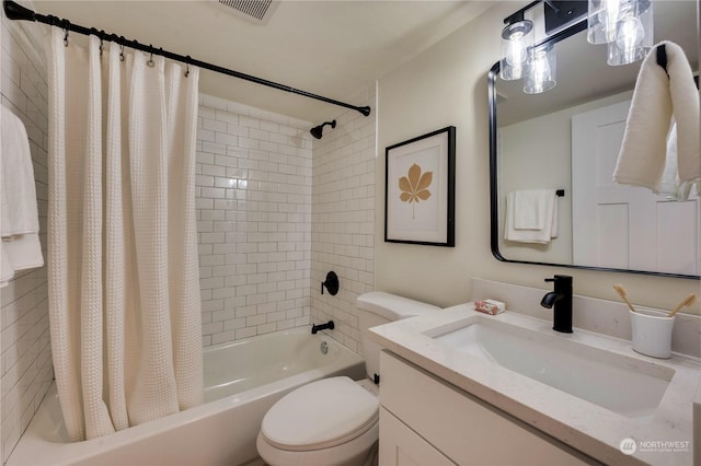 full bathroom featuring shower / tub combo, vanity, and toilet