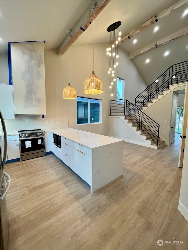 kitchen featuring stainless steel electric stove, beamed ceiling, white cabinets, hanging light fixtures, and kitchen peninsula