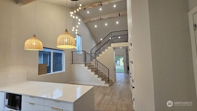 interior space featuring hardwood / wood-style flooring, wine cooler, high vaulted ceiling, and beamed ceiling