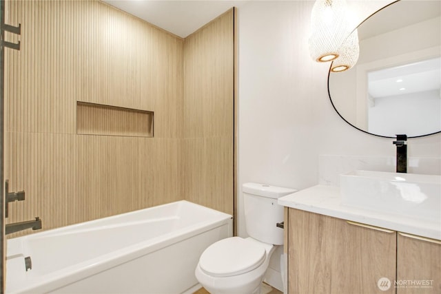 full bathroom with vanity,  shower combination, and toilet