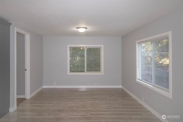 spare room with light wood-type flooring