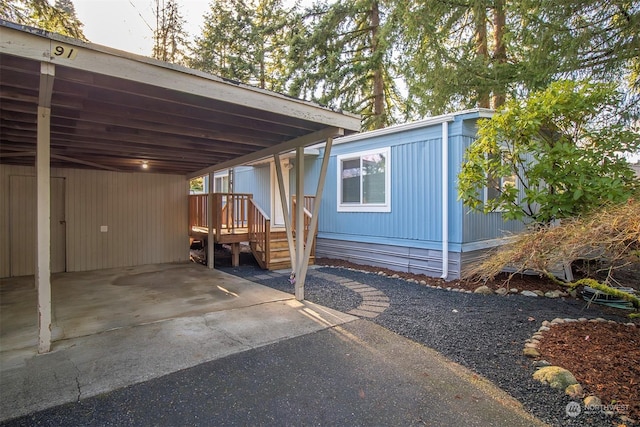 exterior space with a carport