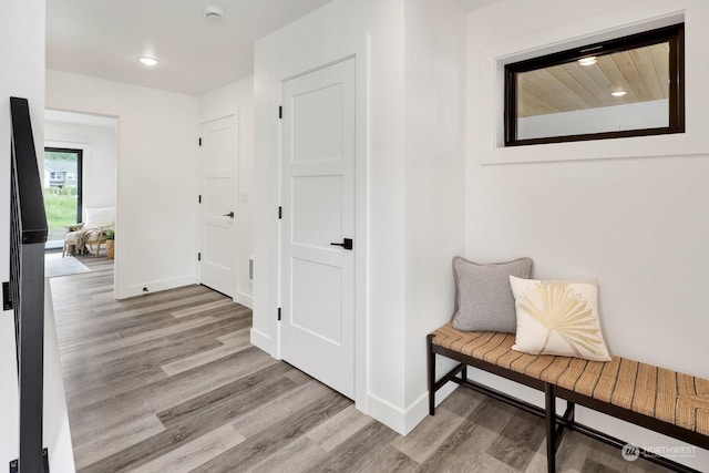 hallway with light wood-type flooring