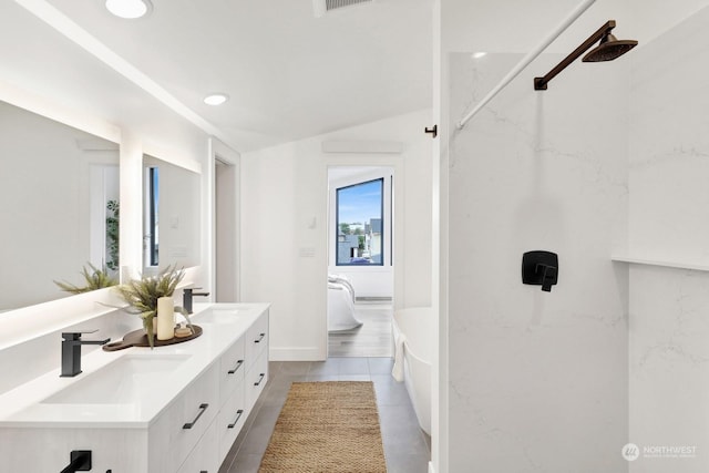 bathroom featuring tile patterned flooring and vanity