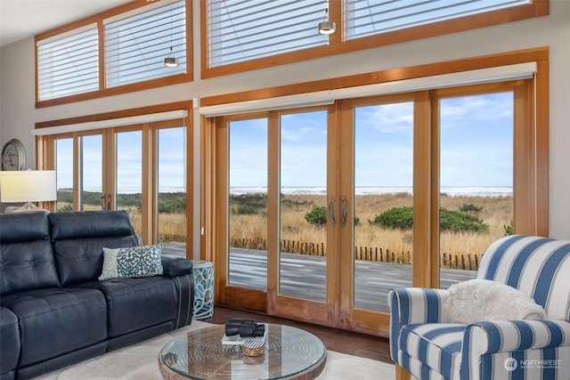 living room featuring a water view and french doors