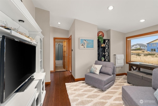 living room featuring hardwood / wood-style floors and vaulted ceiling