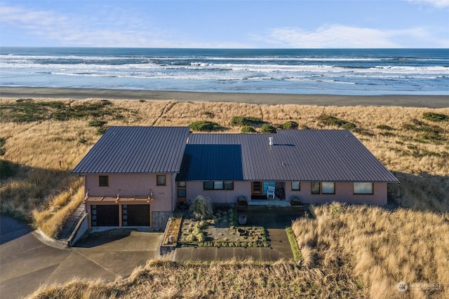 aerial view featuring a beach view and a water view