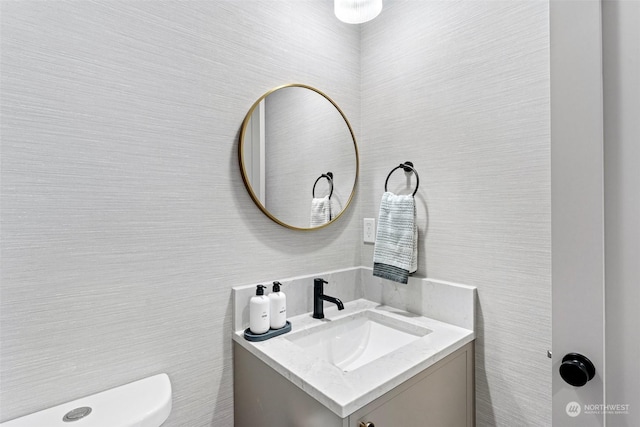 bathroom with vanity and toilet