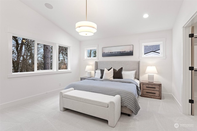 carpeted bedroom featuring vaulted ceiling