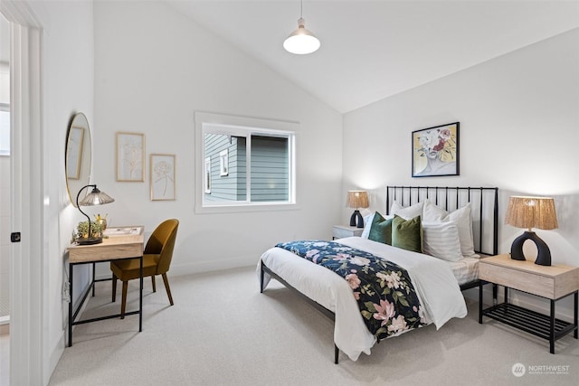 bedroom featuring light colored carpet and lofted ceiling