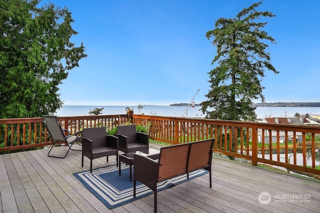 wooden deck with a water view