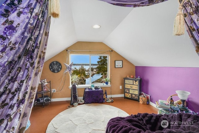 bedroom with lofted ceiling