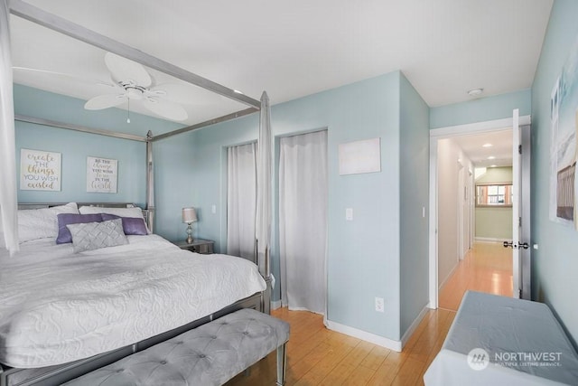 bedroom featuring light wood-type flooring and ceiling fan