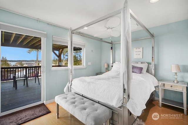 bedroom featuring hardwood / wood-style floors and ceiling fan