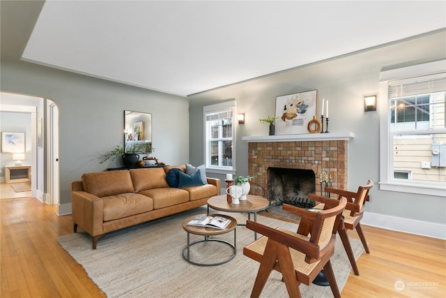 living room featuring a fireplace and light hardwood / wood-style floors