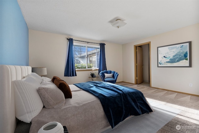 carpeted bedroom featuring a textured ceiling