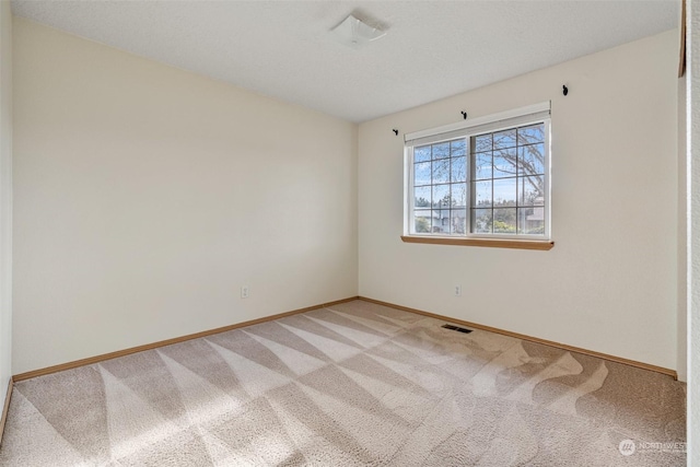 spare room with carpet flooring